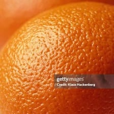 An orange showing its textured outer rind