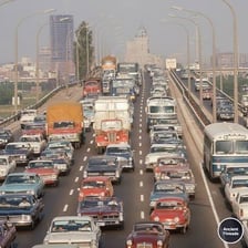 A long line of cars stopped in congested rush-hour traffic.
