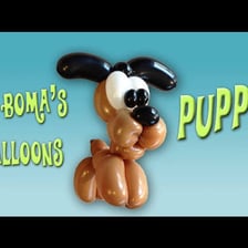 A dog-shaped balloon animal made from a long twisted balloon.