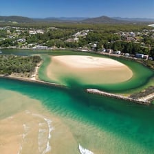 An aerial view of a narrow coastal inlet.