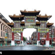 A traditional paifang gateway at the entrance to a Chinatown