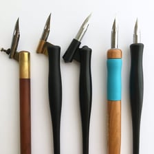 A collection of calligraphy pens with interchangeable nibs
