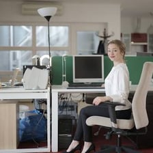 A junior office assistant working at a desk
