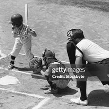 A baseball umpire positioned behind home plate.