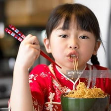 A person noisily slurping noodles