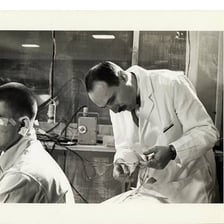 A person stimulating a reaction in a laboratory experiment