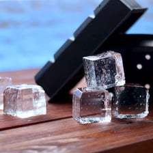 Clear ice cubes, water in its frozen solid form.