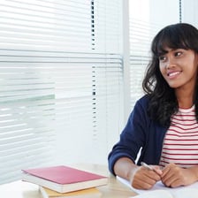 A student studying with SAT preparation materials