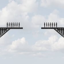 Two people standing apart from one another.