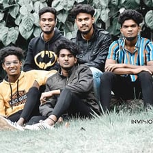 A group of boys standing together outdoors
