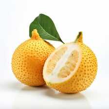An ugli fruit showing its thick, wrinkled greenish-yellow skin.