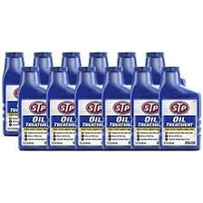 A bottle of STP automotive oil treatment.