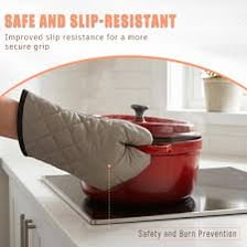 Heat-resistant oven mitts beside a baking tray.