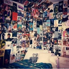A wall covered with colorful posters