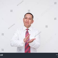 A person wearing a subtle amused expression