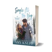 A paperback romance novel with a couple pictured on its cover.