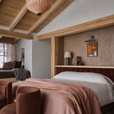 A bed made up in a bedroom.