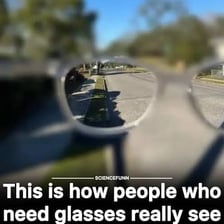 A person looking closely at an object.