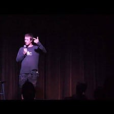 A comedian performing a humorous gag