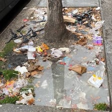 Discarded trash scattered on a city street