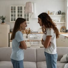 A child responding defiantly to a parent