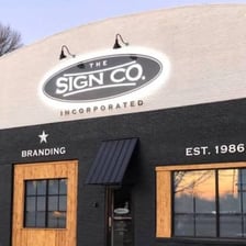 A business sign displaying a company name ending in Inc.