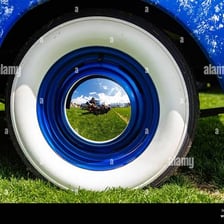 A car with its wheels clearly visible.