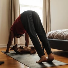 A person performing yoga on an exercise mat