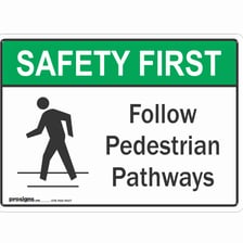 A person following an instruction shown on a road sign.