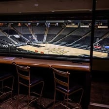 A sports arena viewed from a premium skybox.