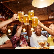 People raising glasses in a celebratory toast