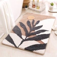A rug placed beside a bathtub