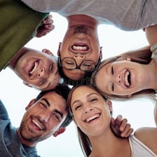 A close-knit group of friends standing together