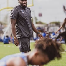 A coach encouraging an athlete during a competition