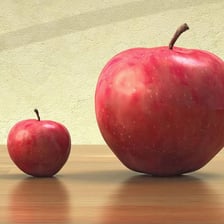 A very small object shown beside a much larger one.
