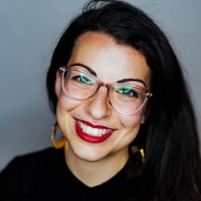 A portrait of Anita Sarkeesian.