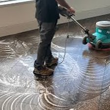 A polished floor reflecting light after being waxed.