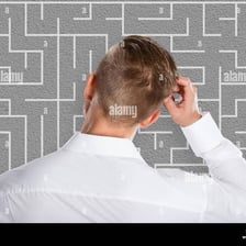 A thoughtful person concentrating while solving a puzzle