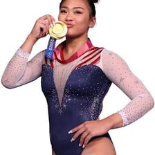 Suni Lee competing as an artistic gymnast