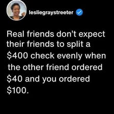 Two diners dividing a restaurant bill into equal shares.