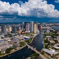 A waterfront view of Tampa Bay with the Tampa skyline.
