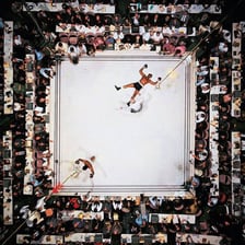 Muhammad Ali boxing in a ring