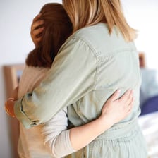 A friend comforting another person after an upsetting experience
