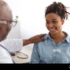 A hand giving someone a gentle pat on the shoulder
