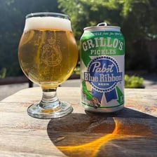 A Pabst Blue Ribbon beer can associated with Grillo’s Pickles flavor.