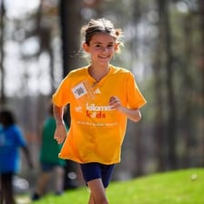 Runners participating in a short one-kilometer road race.