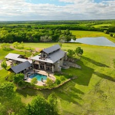An aerial view of a large estate and its surrounding land.
