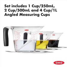 OXO-branded kitchen tools, including a peeler and measuring cup.