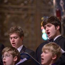 Men singing together in a choir.