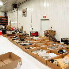 Items grouped and labeled as lots at an auction